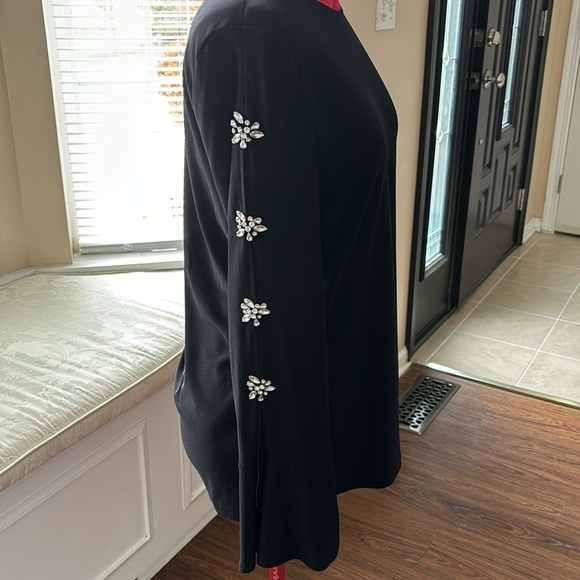 Black polyester/spandex blend, with embellished sleeves. - Picture 1 of 9